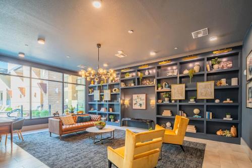 a living room filled with furniture and a chandelier at Peaceful 1BR Kierland Common, TPC Golf, Pool, Gym, W-D in Scottsdale