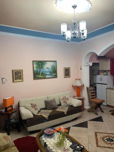 a living room with a couch and a table at HILL Of SAN PIETRO in Durrës