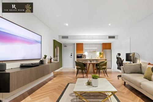 a living room with a couch and a tv at The Brass Pineapple Surfers Paradise 4217 - Wyndham Surfers Paradise in Gold Coast