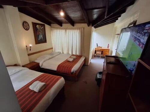 Postel nebo postele na pokoji v ubytování Andean Dreams 1