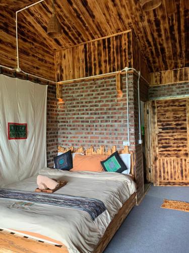Postel nebo postele na pokoji v ubytování Sapa Plum Eco House