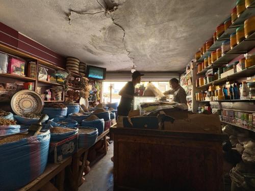 a group of people standing in a shop with at Al Mohit Hôtel Dakhla in Dakhla