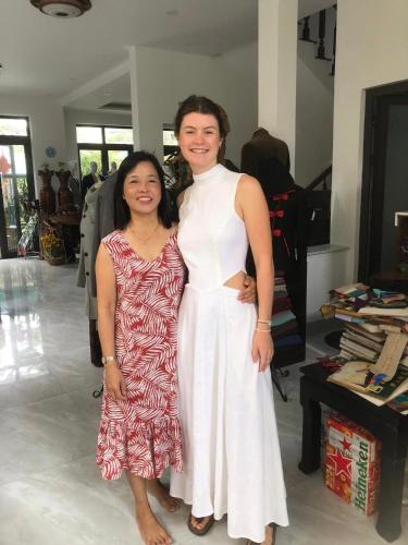 two women are posing for a picture in a store at Quynh Long Villa in Hoi An