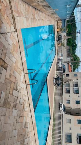 an overhead view of a swimming pool in a building at APT Bela Cintra PRIME 3 km da praia do Aracagy in São Luís