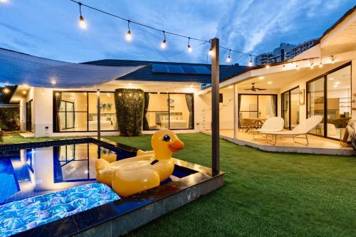 a rubber duck in the yard of a house at Villa Aura Chiang Mai in Chiang Mai