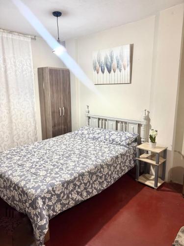 a bedroom with a bed in a room at Florencia Lodgement in Lima