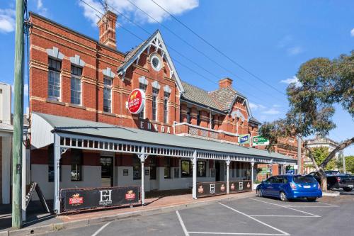 a building with a car parked in front of it at Euroa Hotel in Euroa