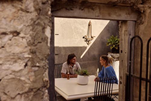 a man and a woman sitting at a table at The Customs House Port MacDonnell in Port MacDonnell