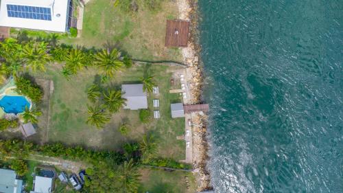 an aerial view of an island next to the ocean at Belles on Ballow - Lorikeet Lodge - Absolute Waterfront in Amity Point