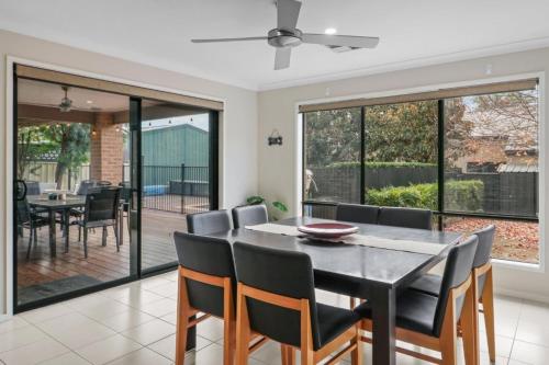 a dining room with a table and chairs at Mansfield Accommodation - Sojourn on Stewart in Mansfield