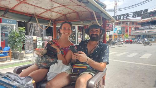a man and a woman sitting in a cart at Kakrona Pouk Homestay in Siem Reap