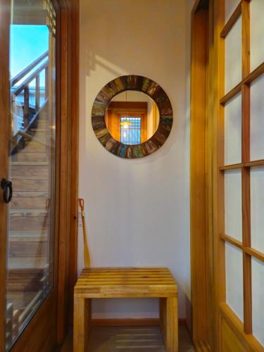 a room with a wooden door and a mirror at Haenggung stay Dalno - Suwon private house hanok in Suwon