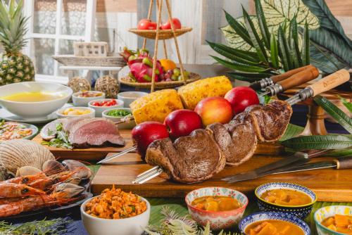 a table topped with lots of different types of food at パプリカホテルです in Kisarazu