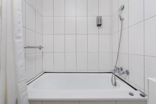 a bathroom with a shower with a bath tub at Sun Moon Lake ItaThao Vacation Inn with Elevator in Yuchi