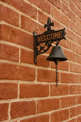 a street sign hanging on a brick wall at Hotel Casa Acueducto - Lujo Cultural in Oaxaca City