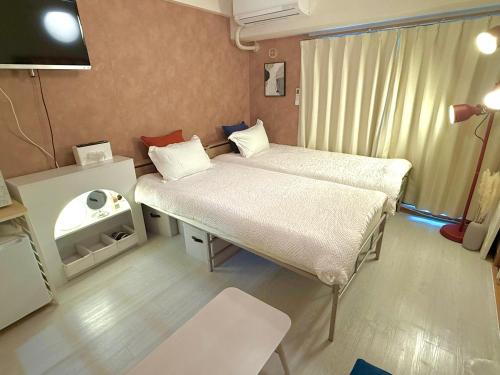 Postel nebo postele na pokoji v ubytování Omori 8min Stylish and comfortable room