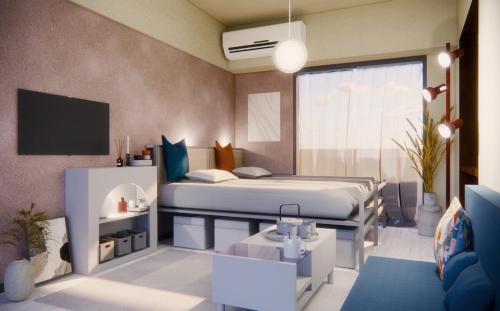 a bedroom with a bed and a tv in it at Omori 8min Stylish and comfortable room in Tokyo