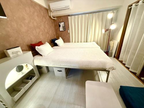 Postel nebo postele na pokoji v ubytování Omori 8min Stylish and comfortable room