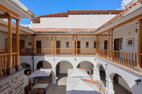 an empty courtyard of a building with a balcony at Casa Andina Standard Ayacucho in Ayacucho