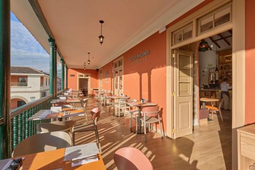 a restaurant with tables and chairs on a balcony at Casa Andina Standard Ayacucho in Ayacucho