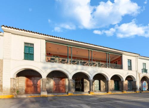 a building with a balcony on top of it at Casa Andina Standard Ayacucho in Ayacucho