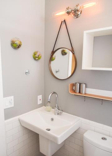 a white bathroom with a sink and a mirror at Peaceful Sonoma Oasis with Pool in Sonoma