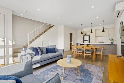 a living room with a couch and a table at Hidden Valley Resort in Wallan
