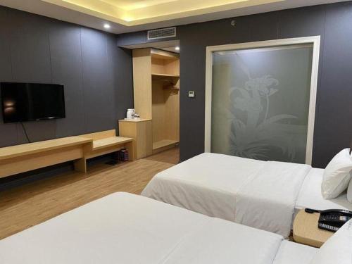 TV a/nebo společenská místnost v ubytování 7 Days Inn Fucheng Wu Gongci Gaodeng East Street Binjiang Road