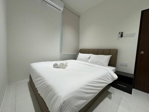 Ένα ή περισσότερα κρεβάτια σε δωμάτιο στο 161 Home Sleep Home Langkawi