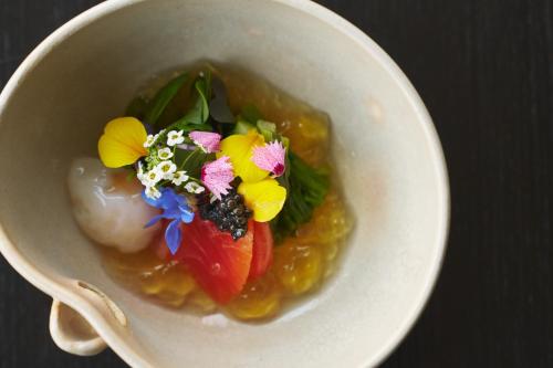 a white bowl of food with flowers in it at Hakone Hisui in Hakone