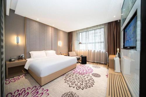 Postel nebo postele na pokoji v ubytování Lavande Hotel Xi'an 1st Fengcheng Road Municipal Library Metro Station