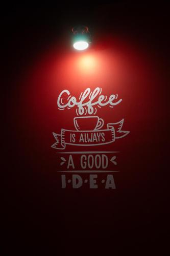a sign that reads coffee is always a good idea at U Street Capsule Hostel in Washington