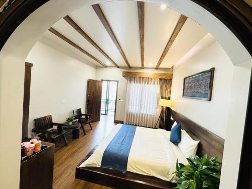 a bedroom with a large bed in a room at Sapa Pine Hill Eco Lodge in Sa Pa