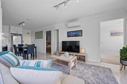 a living room with a couch and a table at Inviting 2BR Stay by the Sand at Rockingham in Rockingham