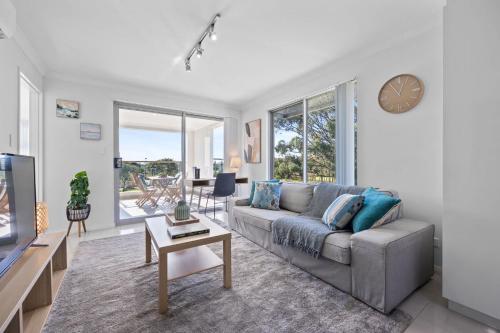 a living room with a couch and a tv at Inviting 2BR Stay by the Sand at Rockingham in Rockingham