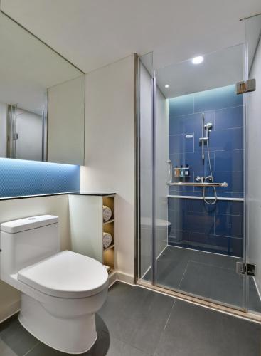 a bathroom with a toilet and a shower at Holiday Inn Express Chengdu North Railway Station by IHG - Near Panda Base, Near Chunxi Road in Chengdu