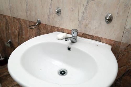 a white sink in a bathroom with at House with Private Pool Perfect for Family Holiday in Mount Lavinia