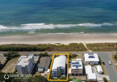 an aerial view of a building near the beach at Above The Dunes in Woorim