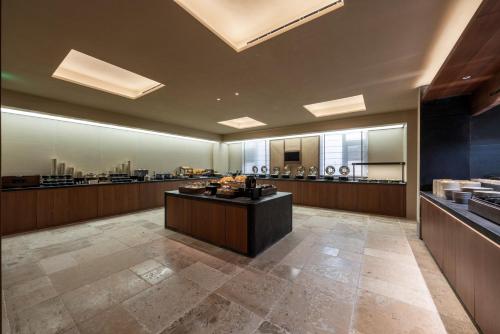 a large room with a counter and a salon at Atour Hotel Beijing Bird's Nest West Huixin Street North Exit Subway Station in Beijing