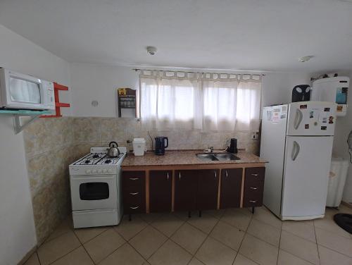 Η κουζίνα ή μικρή κουζίνα στο Duplex Unquillo