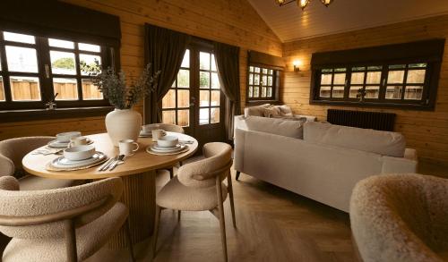 a living room with a table and a couch at St Hildas Complex in Hinderwell