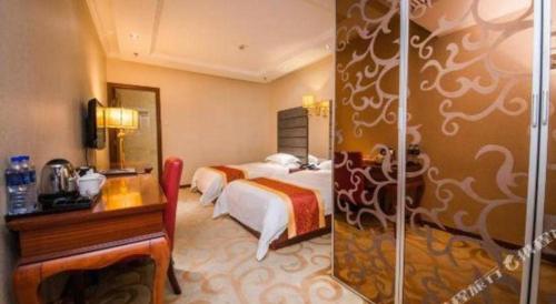 a hotel room with two beds and a shower at Milu Hotel in Guangzhou