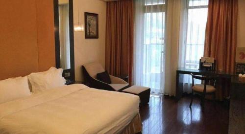 Postel nebo postele na pokoji v ubytování Xiamen SIG Resort