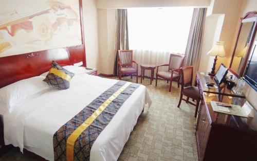 Letto o letti in una camera di Vienna Hotel Nanning Train Station