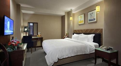 Cama o camas de una habitación en Shenzhen Hanyong Hotel Fuyong Branch