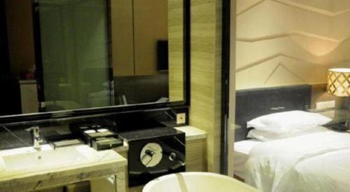 Letto o letti in una camera di Urumqi Tianyuan Hotel