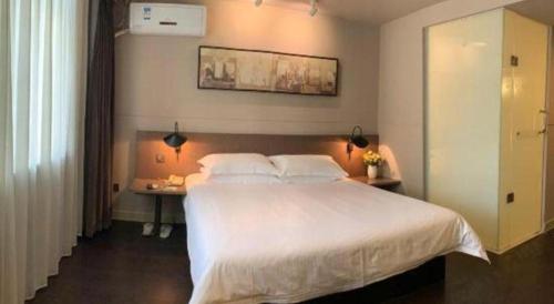 Katil atau katil-katil dalam bilik di Jinjiang Inn Select Nanjing South Railway Station North Square