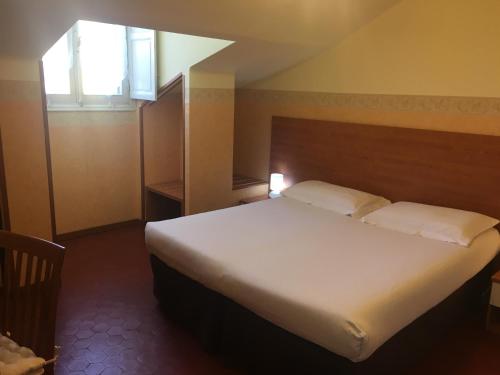 Katil atau katil-katil dalam bilik di Hotel Liberty