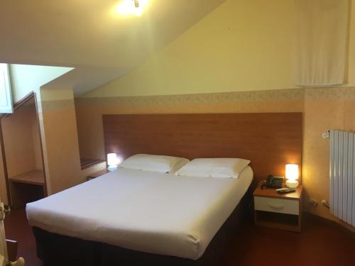 Postel nebo postele na pokoji v ubytování Hotel Liberty