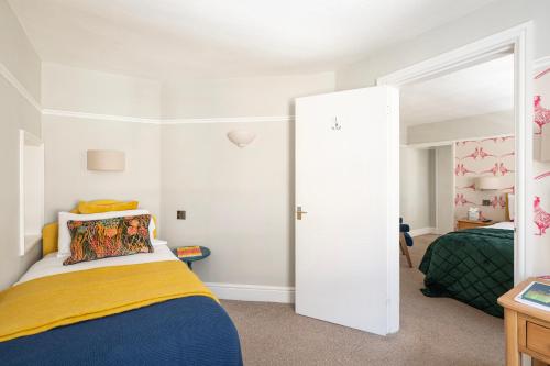 Postel nebo postele na pokoji v ubytování Harington's Boutique Hotel